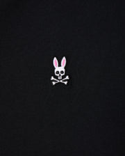 The Psycho Bunny Men's Big and Tall Classic Crew Neck Tee (B9U014CRPC) showcases a white skull with rabbit ears, pink interior, and crossbones. Made from 100% Pima cotton, this elegant design pops on its black fabric background.