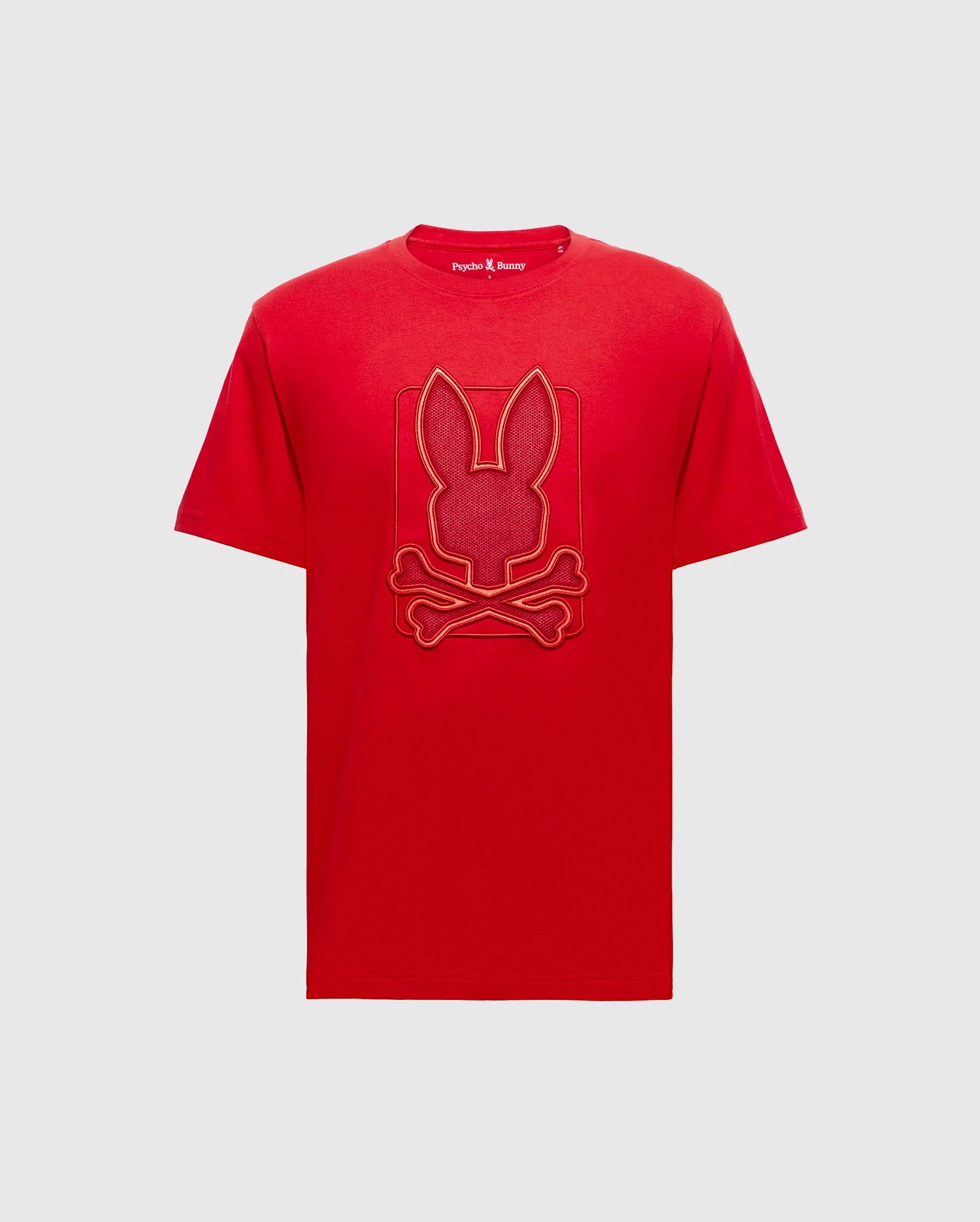The Psycho Bunny BIG AND TALL PIERCE GRAPHIC TEE - B9U115E200 is a red Pima cotton short-sleeve shirt with a ribbed crew neck, featuring a bunny embroidery with crossed bones.