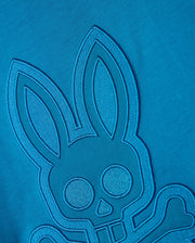 The BIG AND TALL MALTON GRAPHIC TEE - B9U795D200 by Psycho Bunny features a detailed blue embroidered design on premium Pima cotton, showcasing a rabbit with large ears and round eyes and a skull and crossbones motif against a matching blue background, highlighting exquisite Peruvian craftsmanship.