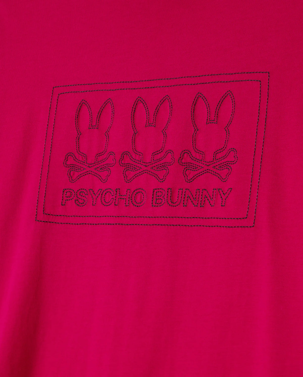 The Psycho Bunny BIG AND TALL TACOMA GRAPHIC TEE - B9U909D200 is a soft Pima cotton red tee featuring three embroidered bunny skull logos with crossed bones and the "Psycho Bunny" name elegantly framed below the design.