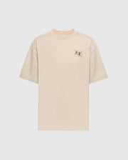 The Psycho Bunny Men's Big and Tall Monroe Oversized Tee - B9U910D200 is a light beige, soft pima cotton T-shirt with a relaxed fit crew neckline, short sleeves, and a minimalistic rectangle graphic with an illustration and text on the left chest against a white background.