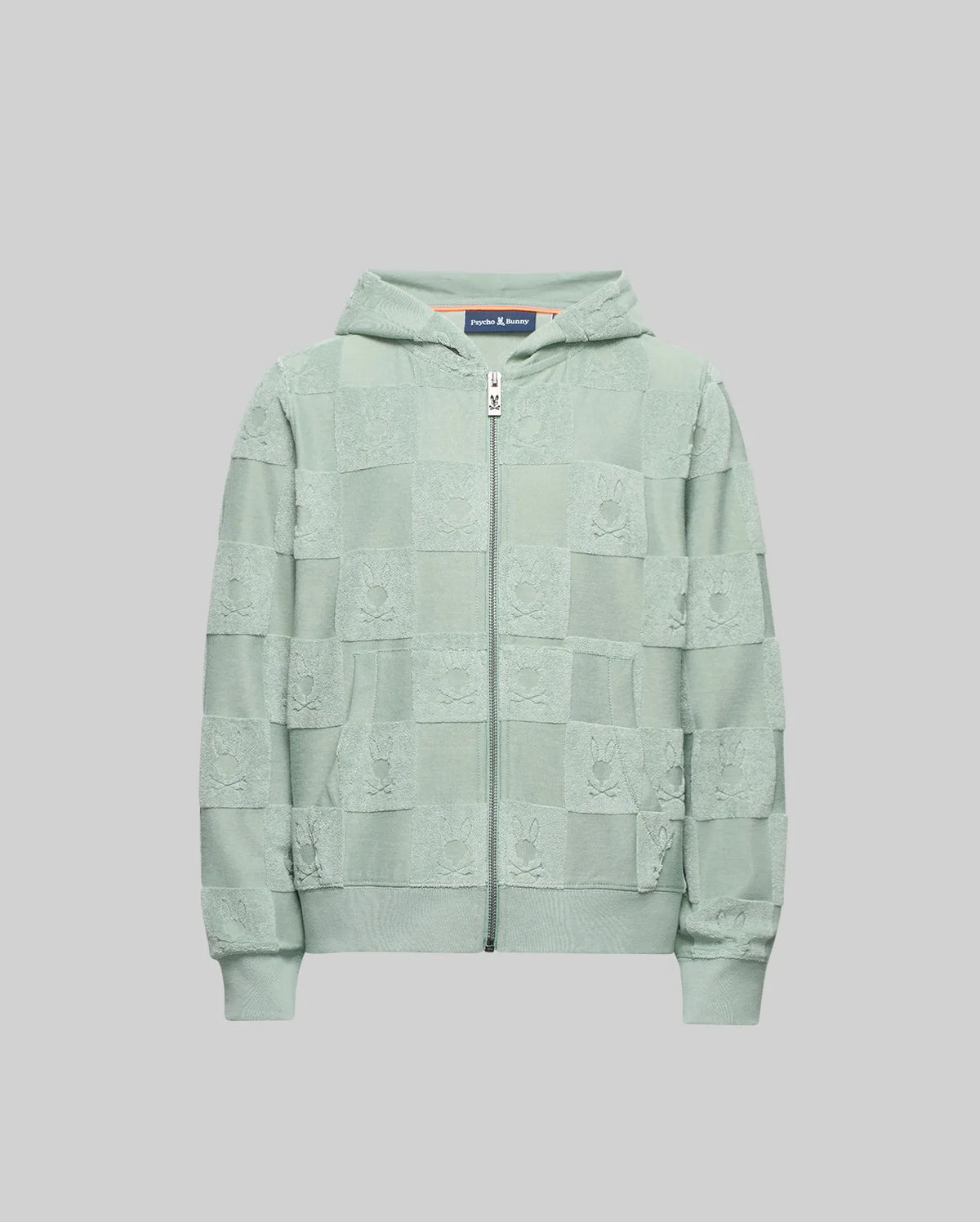 The Psycho Bunny KIDS KELVIN FULL ZIP TOWEL TERRY HOODIE - KT0500004 is a light green cotton blend zip-up with a Jacquard terry checkered pattern, shown on a plain grey background.