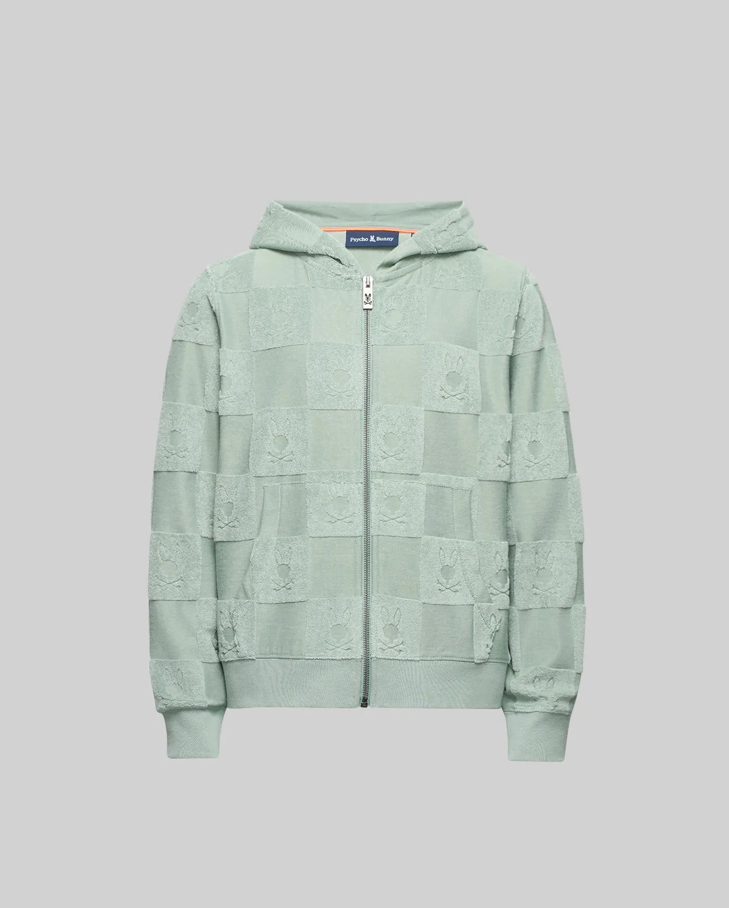 The Psycho Bunny KIDS KELVIN FULL ZIP TOWEL TERRY HOODIE - KT0500004 is a light green cotton blend zip-up with a Jacquard terry checkered pattern, shown on a plain grey background.
