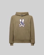 The KIDS WADE CORD PATCH HOODIE (KT0500031) by Psycho Bunny is an olive green cotton blend athletic hoodie with a front pocket, hood, and an embroidered bunny patch—white ears and navy blue "B" over crossed white bones on the chest.