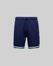 The Psycho Bunny MENS BASIL TAPED SHORT (MB0900005) in navy features an elastic waistband with drawstring and white, teal, and navy striped trim at the hem, crafted from a premium cotton-modal blend, shown on a plain grey background.