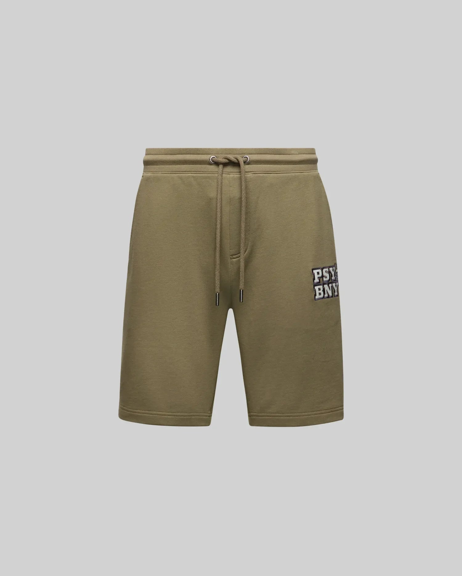 The MENS WADE SWEATSHORT - MB0900028 by Psycho Bunny features olive green, classic athletic style with side pockets, an embroidered "PSYBNY" patch on the left leg, and a premium cotton blend. Shown against a plain light gray background.