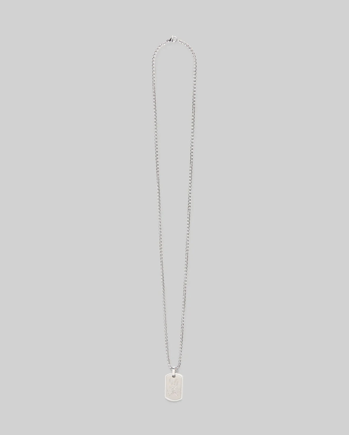 The Psycho Bunny MENS ARMY TAG NECKLACE - MO1700021 features a silver rectangular dog tag pendant on a steel cable chain, shown against a plain light gray background.