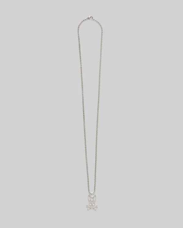 The MENS BUNNY NECKLACE - MO1700022 by Psycho Bunny features a steel pendant with a skull and crossbones design, set against a plain light gray background.