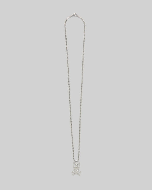 The MENS BUNNY NECKLACE - MO1700022 by Psycho Bunny features a steel pendant with a skull and crossbones design, set against a plain light gray background.