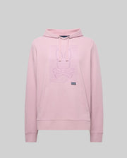 The Psycho Bunny MENS GRANT HOODIE - MT0500032 in light pink is crafted from a premium cotton blend, featuring a kangaroo pocket and a raised bunny head with crossed bones outline graphic on the chest. Background: plain light gray.
