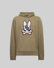 The Psycho Bunny MENS WADE HOODIE - MT0500112 is a khaki cotton-blend hoodie with white bunny ears graphic, an embroidered navy "PB" Bunny patch, white crossed bones on the chest, front pocket, and drawstrings.