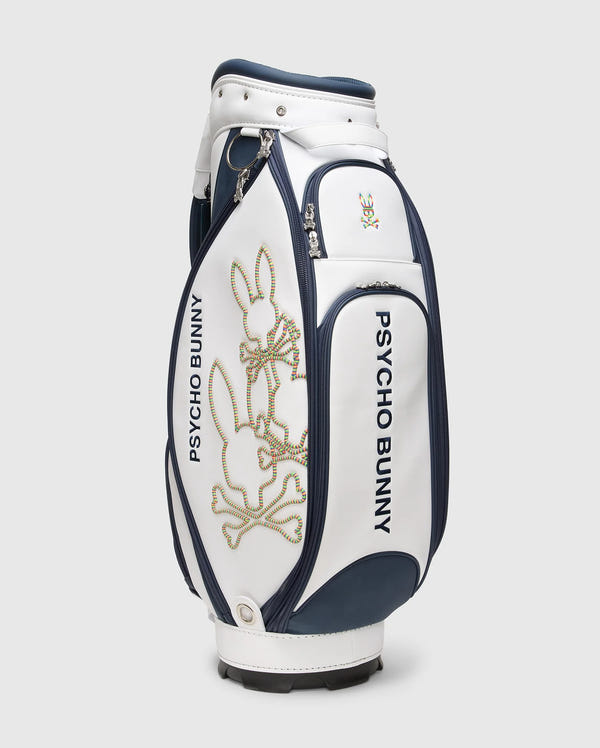 The OUTLINE BUNNY GOLF TOUR BAG - PBMG4FC1 by Psycho Bunny features the iconic "Psycho Bunny" branding in navy and white with a stylized bunny logo. This sleek polyurethane bag offers five-pocket club dividers and multiple compartments for optimal organization on the course.