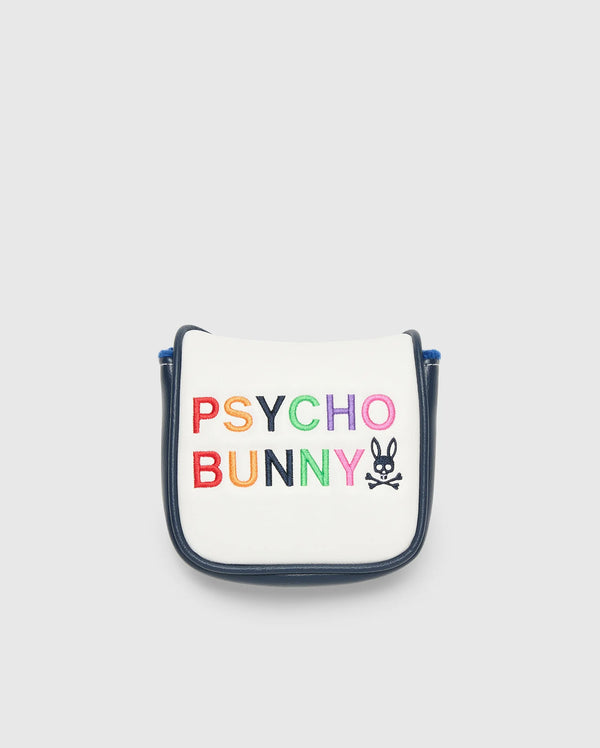 A small white golf putter cover with a navy border, made in China, showcases "Psycho Bunny" in colorful block letters. A bunny logo with crossbones completes the playful design.