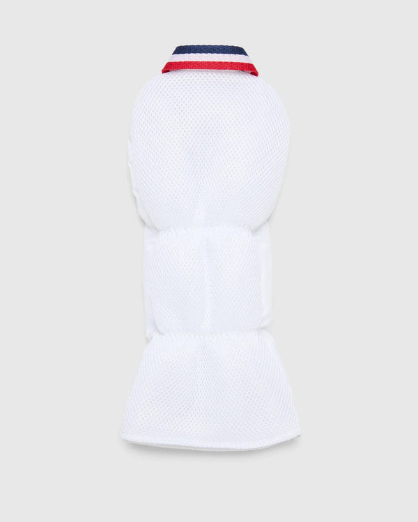 The white padded MULTI BUNNY DRIVER HEAD COVER - PBMG4SH1 by Psycho Bunny combines warmth and style with its quilted texture, navy-blue and red collar, and minimalist design. The embroidered logo adds a subtle elegance to the sleek look against a plain background.